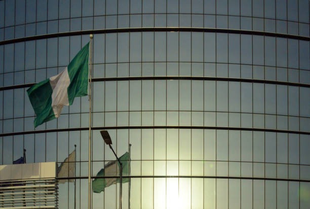 imgi_44_flag-of-nigeria-and-modern-glass-façade-lagos-nigeria Imgi 44 Flag Of Nigeria And Modern Glass Facade Lagos Nigeria 2